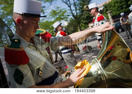 Paris France - July 14 2011. Legionnaire musician of the French foreign legion prepares his instrument before the parade on the Champs Elysees