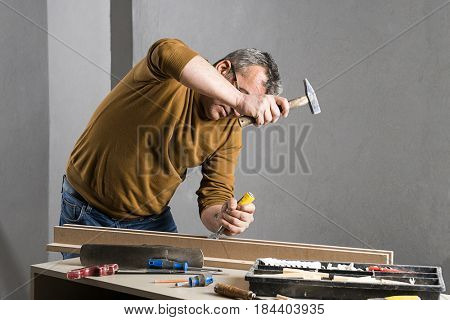 Carpenter Carving Plank with Chiesel