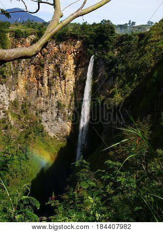 Sipiso-piso waterfall with rainbow, North Sumatera, Indonesia
