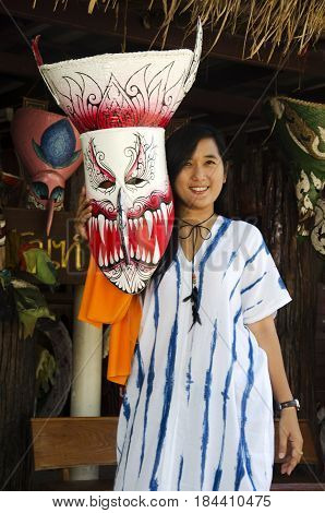 Asian Thai Woman Wearing Mask Head With Costume Of Phi Ta Khon Dance And Playing At Phi Ta Khon Muse