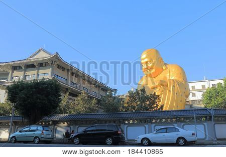 TAICHUNG TAIWAN - DECEMBER 9, 2016: Unidentified people visit Bao Jue temple. Bao Jue temple is most famous for the presence of a giant smiling Buddha.