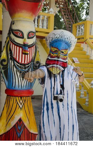 Asian Thai Woman Wearing Mask Head With Costume Of Phi Ta Khon Dance And Playing At Phi Ta Khon Muse