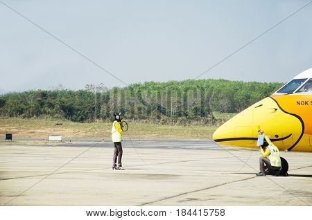 Thai Aircraft Marshaller Marshalling And Visual Signal Between Ground Personnel And Pilots On Airpla