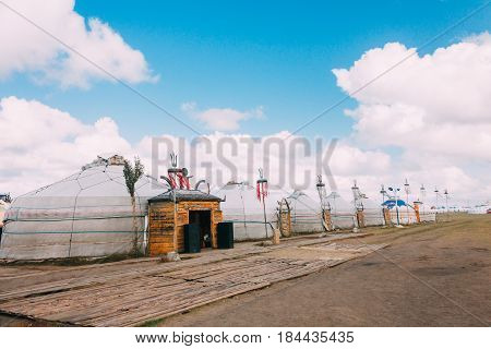 Landscapes Of Mongolia, Yurts Against The Backdrop Of Blue Sky