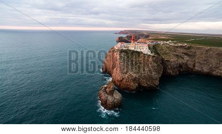 View of the lighthouse and cliffs at Cape St. Vincent at sunset. Continental Europe's most South-western point, Sagres, Algarve, Portugal.