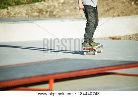 Close-up Skateboarder's legs skateboard on concrete. Skating On skateboard popular youth extreme sports in Russia