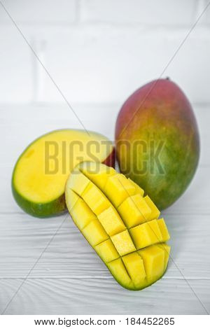 Mango On A White Wooden Background