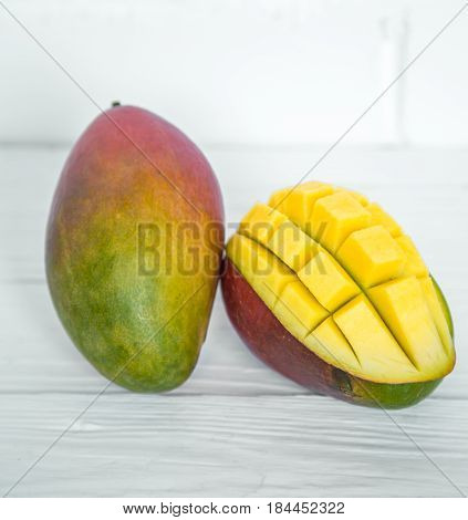 Mango On A White Wooden Background