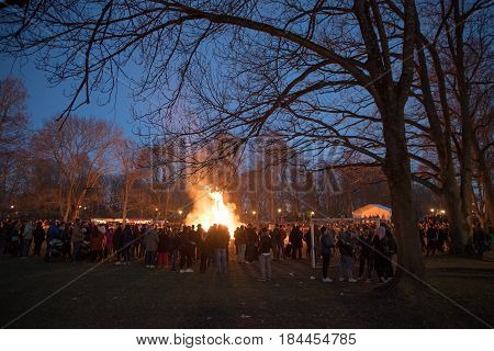 NORRKOPING, SWEDEN - APRIL 30, 2017: Traditional Swedish celebration of spring at Walpurgis night with bonfire and music at Folkparken in Norrkoping. The festival is named after Saint Walpurga.