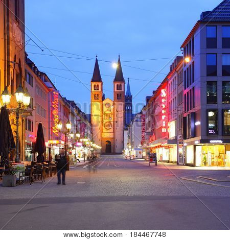 Wurzburg, Germany - April 21, 2013: Shopping street in front of the Wurzburger Dom church in the Old Town of Wurzburg