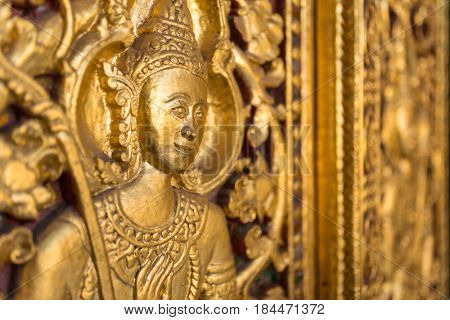 Beautiful golden carving on the door of Wat Sensoukharam temple in Luang Prabang, Laos