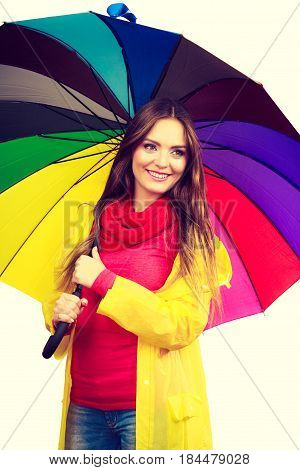 Woman In Rainproof Coat Under Umbrella