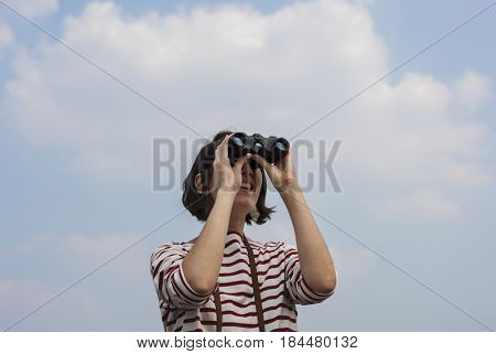 Woman using binocular explore searching