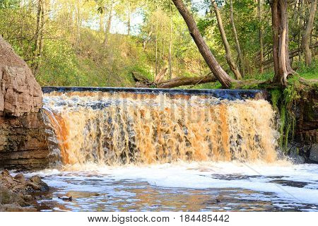Small waterfall on Sablinka River in Leningrad Region Russia.