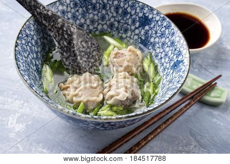 Traditional Chinese Wan Tan Soup as close-up in a bowl