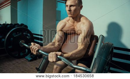 String Man exercise for the biceps in the gym