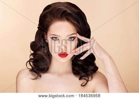 Beautiful Face of Young Woman with Clean Fresh Skin close up on beige background. Beauty Portrait. Beautiful Spa Woman Smiling. Perfect Fresh Skin. Pure Beauty Model. Youth and Skin Care Concept