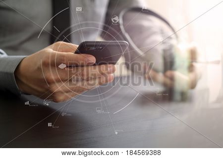 Businessman Using Voip Headset With Mobile Phone And Concept Communication Call Center On Wooden Des