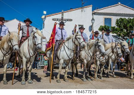Sent-Mari-de-la-Mer, Provence, France - May 25, 2015.  Square in the center of the city. World Festival of Gypsies. Escorts - security guards on white horses before the parade