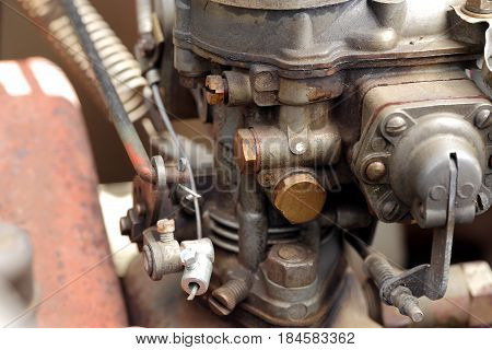 a detail of the carburettor of an old car