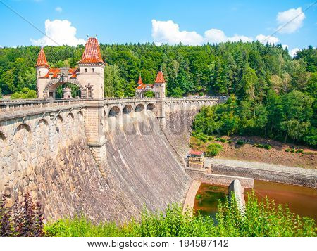 Fairytale dam Les Kralovstvi with picturesque towers on sunny summer day, Czech Republic.