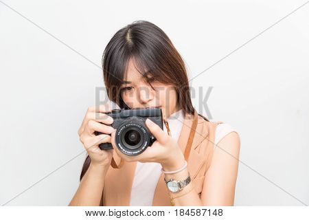 Portrait Of Asian Young Woman Taking Pictures On The White Background