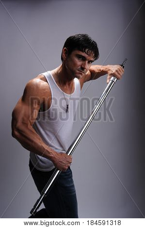 the muscle man is flexing his arms