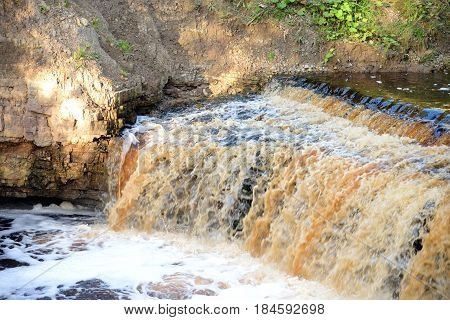 Small waterfall on Sablinka River in Leningrad Region Russia.