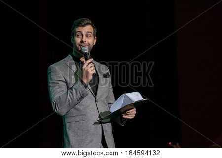 Moscow, Russia - April 24, 2017: Famous Russian showman Ivan Urgant performs at Synergy Global Forum at Crocus Expo Hall. This is one of the largest business forums with more than 5000 participants