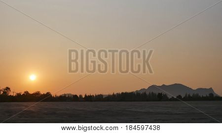 Orange and yellow sunrise with mountains Beautiful sunrise sky natural environment background