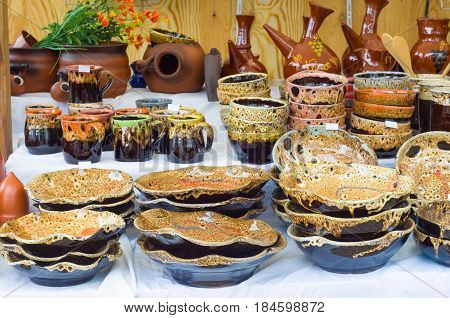 Set clay utensils. Jugs cups bowls vases and jars.