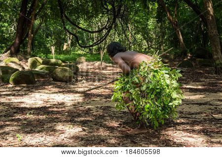 Vedda man holding bow and arrows. Veddas are an indigenous people of Sri Lanka living in tribes in the jungle