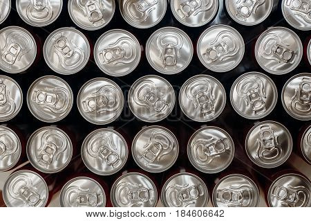 metallic cans top view. pattern can from beer or soda flat lay. steel background. recycling concept. drink bar at wedding reception