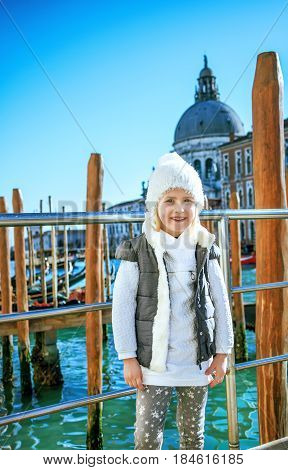 Portrait Of Smiling Trendy Girl In Venice, Italy In Winter