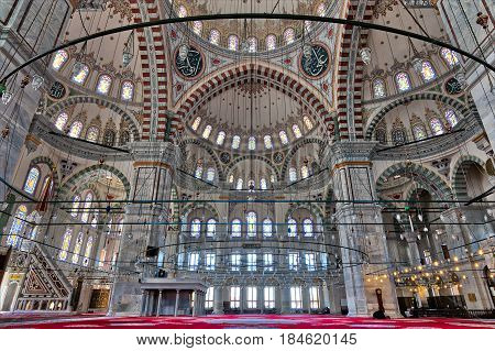 Istanbul, Turkey - April 25, 2017: Fatih Mosque a public Ottoman mosque in the Fatih district of Istanbul Turkey with a huge decorated domes & many colored stained glass windows