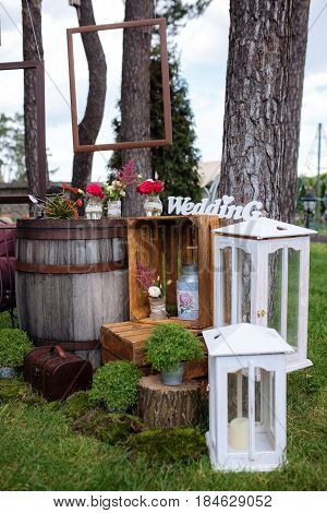 Beautiful Wedding Ceremony Outdoors. Decorated Chairs Stand On The Grass. Wedding Arch Made  Flowers