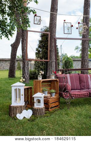Beautiful Wedding Ceremony Outdoors. Decorated Chairs Stand On The Grass. Wedding Arch Made  Flowers