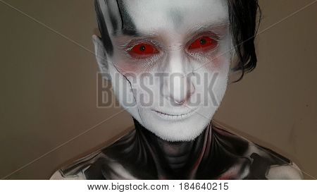 Moscow, Russia - April 2, 2017: Aerography paint at the visitor face making at Tattoo fest
