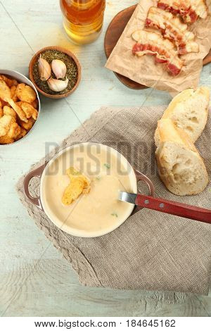 Delicious cream soup on table, top view