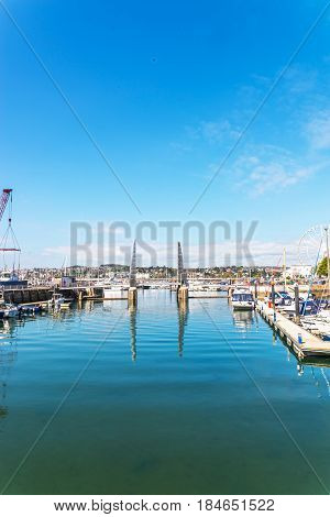 The Gateway To The Sailing Marina With Anchored Boats And Yachtami Metal Moveable Bridge
