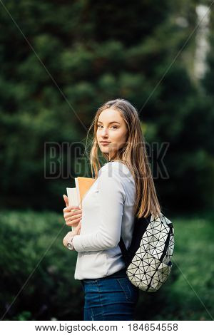 Outdoors Portrait Of A Beautiful Teen Student Girl.