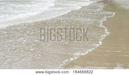 beautiful sunset on the beach in Thailand. Sun and blue sky at the sea waves and sand on a holiday by the sea
