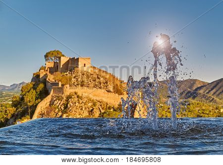 Beautiful Splashing fountain in Xativa Castle of Spain at Sunset