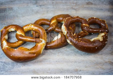 Brezen on wooden background bakery traditional, bavarian