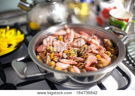Seafood Being Cooked In A Silver Frying Pan
