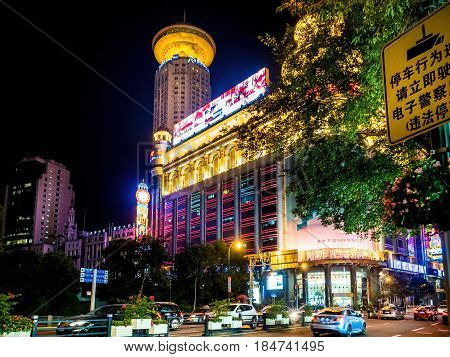 Shanghai, China - Nov 3, 2016: Night scene along Xizang Road (Middle Section) - New World Building with colorful lights in western architectural design.