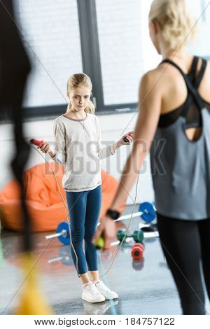 Young Fitness People Exercising With Skipping Ropes At Sports Center