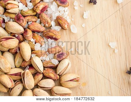 Heap Of Inshell Pistachios And Peeled Pistachios With Large Salt Crystals