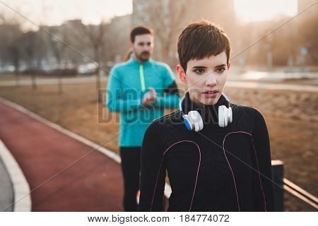 Portrait of fit and beautiful sporty woman outdoor before fitness exercising