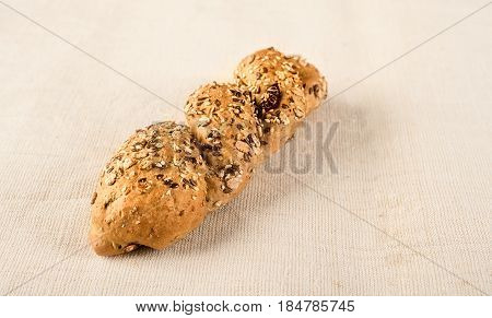 Fresh Seedy Bread On Textile Background